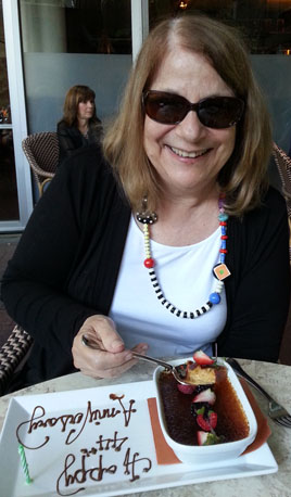 Margie at the Harvest behind her dessert plate